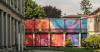 colorful printed textile installation reimagines historic laundry building facade in switzerland