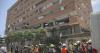 Rescuers in Venezuela race to save security guard trapped under building