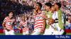 Ten-man USA beat Bosnia-Herzegovina 2-0 to reach last 16