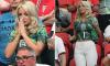 Megan Pickford's iconic match moments! WAG coordinates her £7k Chanel handbag to her cropped football shirt as she prays, fans herself and touches up her lippy during England game