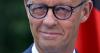Under-fire leader unveils sweeping reforms for Germany