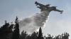 Greece wildfire kills 2, forces 4,000 out as wind-driven flames race toward village