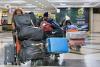Over 270 Ugandans return from South Africa as evacuation begins