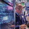 Most US stocks climb towards the finish of a strong week, but drops for tech keep indexes mixed