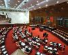Lawmakers advance KMT caning referendum after tight vote