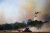 Firefighters race to contain flames in northeastern Spain