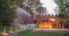 copper shingles wrap curving concert hall ‘la source vive’ in évian, france