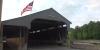 Covered bridges across Vermont fly America 250 flags for Independence Day