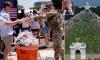 Determined Trump kicks off his 'very long' July 4 speech in front of cheering crowd after weather forced chaotic evacuation of DC's National Mall