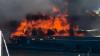 Dramatic moment huge fire breaks out at French port sinking two boats and injuring 14 as clouds of smoke choke harbour