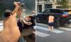 Boy who won social media fame by pushing women into water and squirting cyclists in Paris hires lawyer to sue his critics for 'racism'