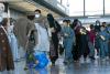 The Latest: Afghan evacuee security checks going smoothly