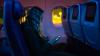 U.S. Influencer Shares Unbelievable Footage Of Passenger Using The Worst Possible Electronic Device On Night Flight