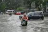 World AFP Rescuers search for missing in China storms after 100,000 flee