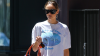 Jennifer Lawrence Proves the Bermuda Shorts Trend Works With Anything—Even a Neon Orange Croc Bag