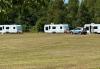 Travellers in more than 20 caravans pitch up on field behind allotments