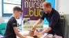 Prince Harry cuts cake during charity hospital visit and reveals son Archie's obsession for Lego
