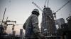 China drops urban employment target as economic pressures build