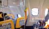 Passenger is sucked out of Ryanair plane window up to his shoulders and has to be pulled back in by other travellers during flight to Germany
