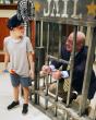 Athens Police Department inducts 7-year-old transplant recipient as honorary officer