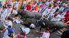 Brit tourist, 24, rushed to hospital after being knocked to ground & trampled at Pamplona bull run as 10 others wounded