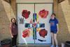 Art students beautify new doors at St. Teresa Regional