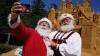 Santas swarm a Danish city in full gear as Europe bakes in summer heat