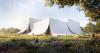 Music Hall Emerges From Croatia’s Fields Draped in Limestone Curtains