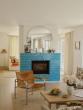 This Swedish Seaside Home Skips Shells in Favor of Sandy Hues and a Bright Blue Fireplace