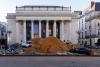 crushed cars emerge from monumental archaeological landscape in ‘fossil opera’