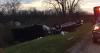 Wind causes pickup truck, camping trailer to flip on I-70
