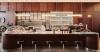modernist-inspired café framed by layered wood and steel extends almaty museum of arts