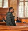 British man accused of killing wife, daughters in court over gun, immigration charges