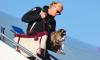 Erling Haaland returns to a hero's welcome - with a stuffed RACCOON as a taxidermy trophy - as Norway's team and fans take part in final Viking Row to toast best ever World Cup run