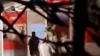 Tourists spark fury after 'simulating sex acts' on memorial to terror victims