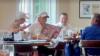 Donald Trump's glamorous aide eats lunch with the president as he holds bizarre AI poster