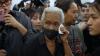 Families claim bodies of victims of deadly Bangkok pub fire