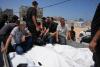 Israel’s latest strikes kill a dozen people in Gaza including police officers