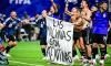 Argentina players hold banner claiming the Falkland Islands after knocking England out of the World Cup