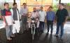DEPD, PEDF present three-wheeled motorcycle to Karachi Press Club employee