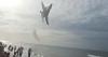 Terror as US Navy jet flies so low over beach it blows umbrellas over