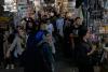 US strikes bridges and collapses a tower at a key port as its Iran campaign expands