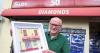 Northern Ireland’s best-known newsagent gifted model of iconic Ballymena shop by acclaimed artist ahead of retirement