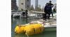 Kuwait Dive Team tows sunken boat from Salmiya waters