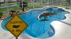 Florida Homeowner Finds 9+ Foot Alligator Just Chilling In Their Swimming Pool