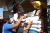 Capitol, DSWD dole out cash, rice, meds to 3,013 farm workers