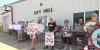 Over a dozen Northwest Iowa residents gather to protest the construction of a data center in their town
