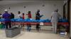 Baton Rouge families pick up free school supplies at District 7 community event