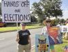 Villagers stand up for voting rights and warn of Trump’s threats to midterm elections