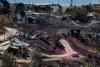 13 homes burnt, dozens damaged in West Bank settlement as crews battle blaze for 2nd day
